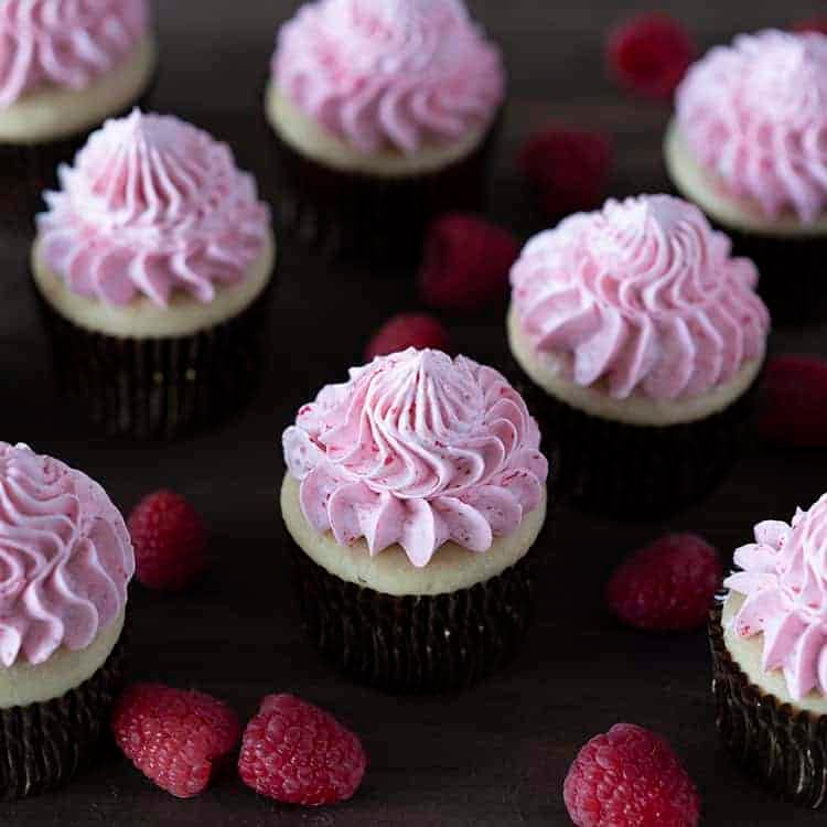 A group of peanut butter and jelly cupcakes on a dark wooden board