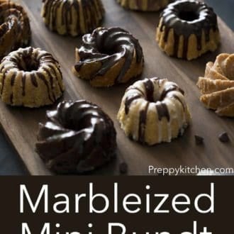 marbelized mini bundt cakes on a dark wood serving board