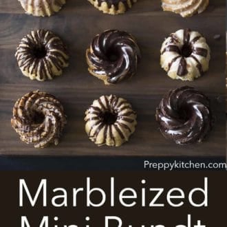 marbelized mini bundt cakes on a dark wood serving board