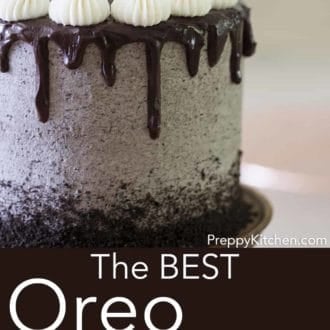 three layer oreo cake with chocolate ganache drip on a cake stand