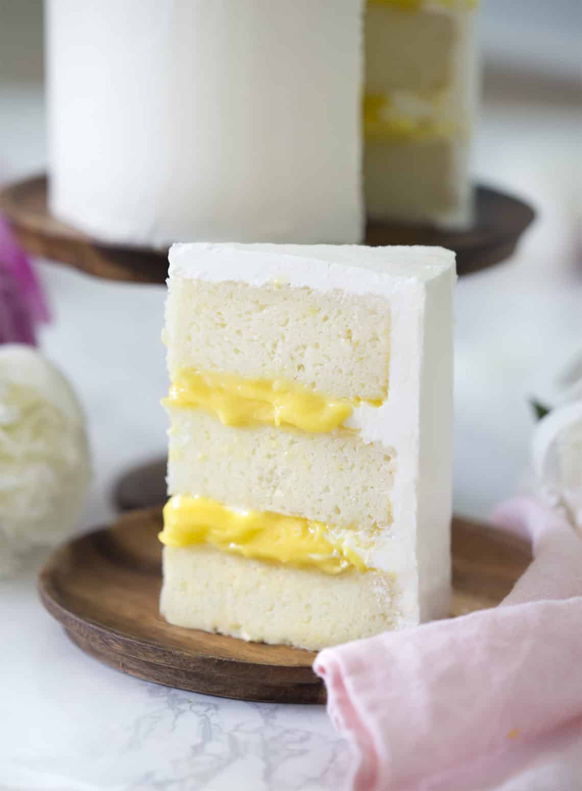 Photo showing a Lemon Elderflower Cake filled with yellow lemon curd