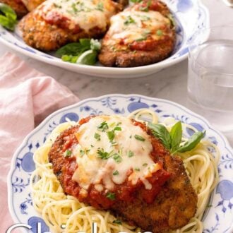 A pinterest graphic of chicken parmesan on a plate of pasta with a platter of more chicken parmesan in the back.