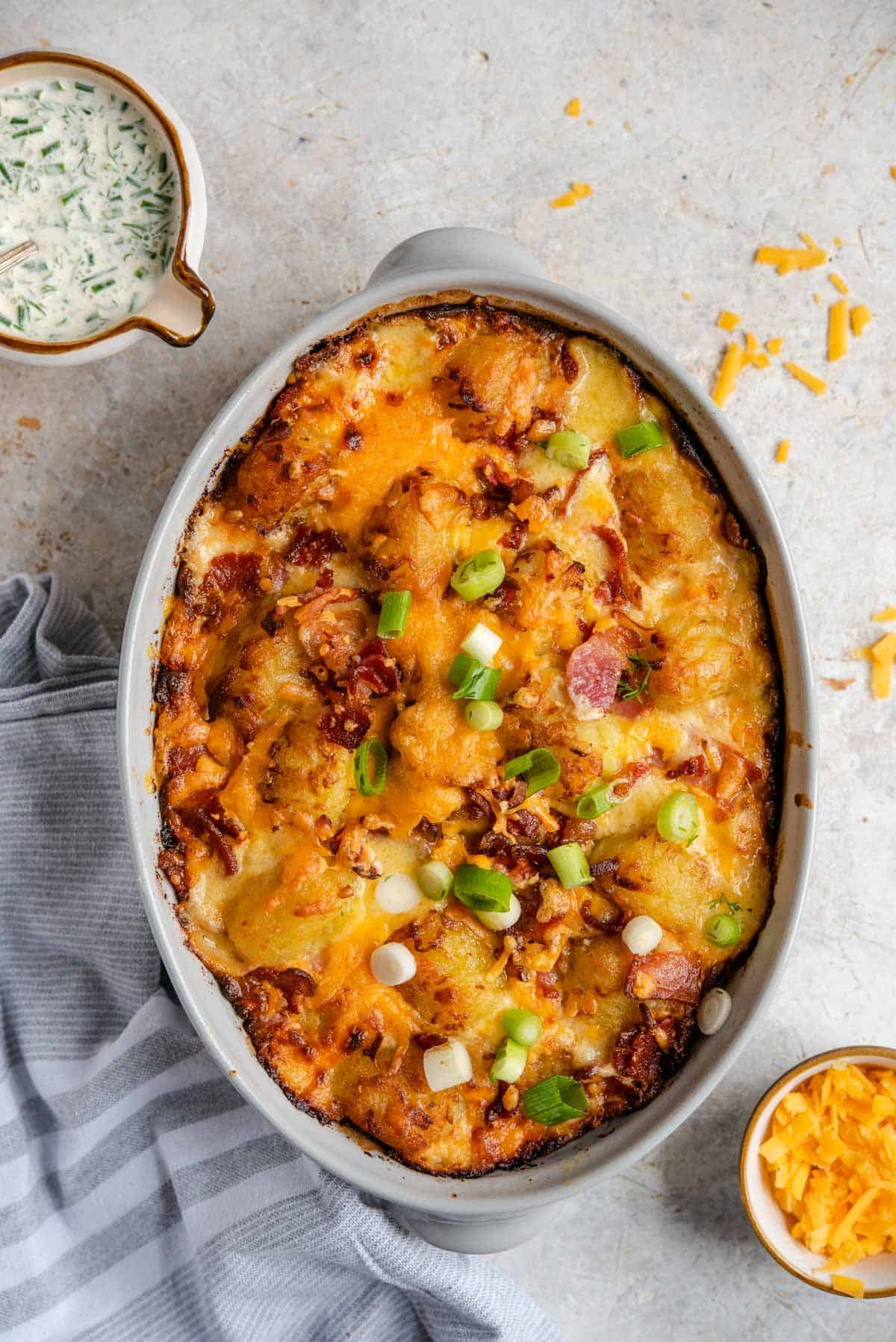 Overhead view of a tater tot casserole topped with green onions.