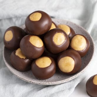A small gray bowl full of buckeye candy.