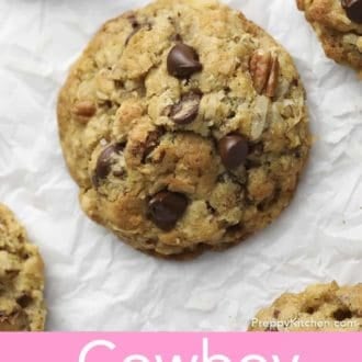 Pinterest graphic of cowboy cookies on parchment paper.