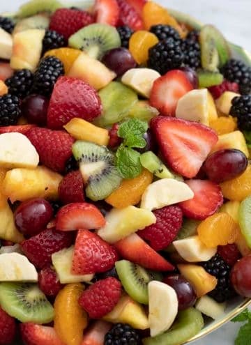 A large bowl filled with homemade fruit salad.