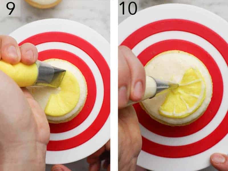 Lemon cupcakes getting decorated with buttercream lemon wedges.