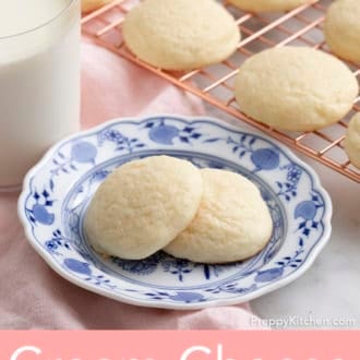cream cheese cookies stacked on a plate