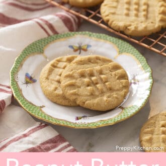 Several peanut butter cookies on a marble counter.