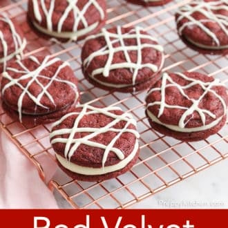 Pinterest graphic of red velvet cookies drizzled with white chocolate on a cooling rack.