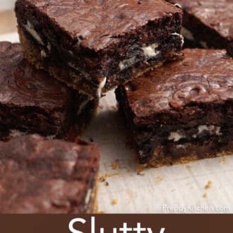 slutty brownies stacked on parchment paper