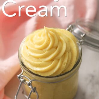 Pinterest graphic of a glass jar filled with vanilla pastry cream on a marble counter.