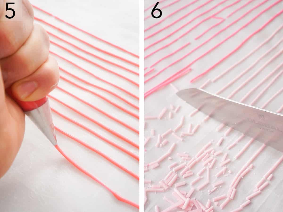 Pink sprinkles getting piped onto parchment paper.