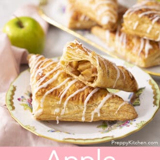 Pinterest graphic of apple turnovers with glaze on a plate with apples and more turnovers on a platter in the back.