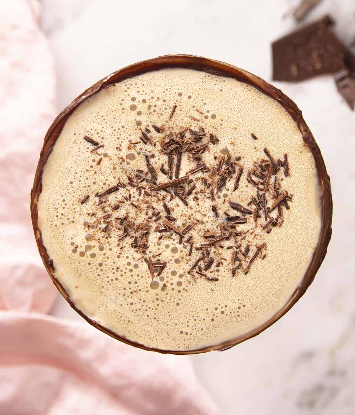 A top down photo of a chocolate martini with a chocolate rim.