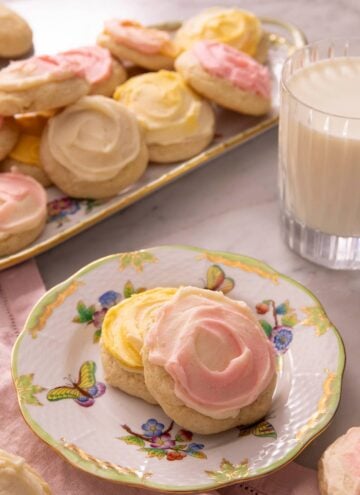 Two sour cream cookies on a china plate
