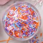 A glass bowl fillerd with colorful homemade sprinkles.