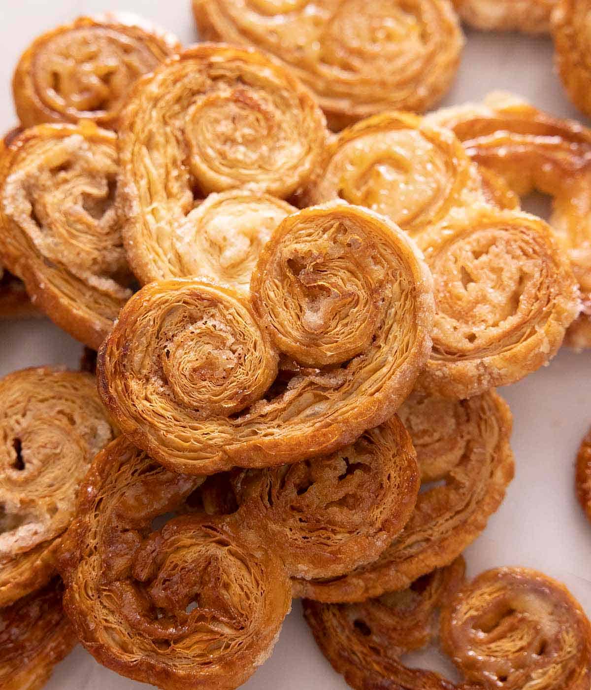 A pile of palmiers, stacked on top of each other.