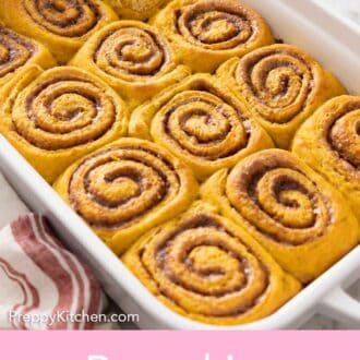 Pinterest graphic of a white baking dish with pumpkin cinnamon rolls.