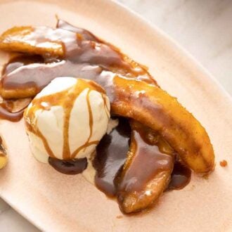 An oval plate with a serving of Banana Foster.