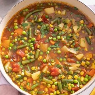 Overhead view of a pot of vegetable soup.