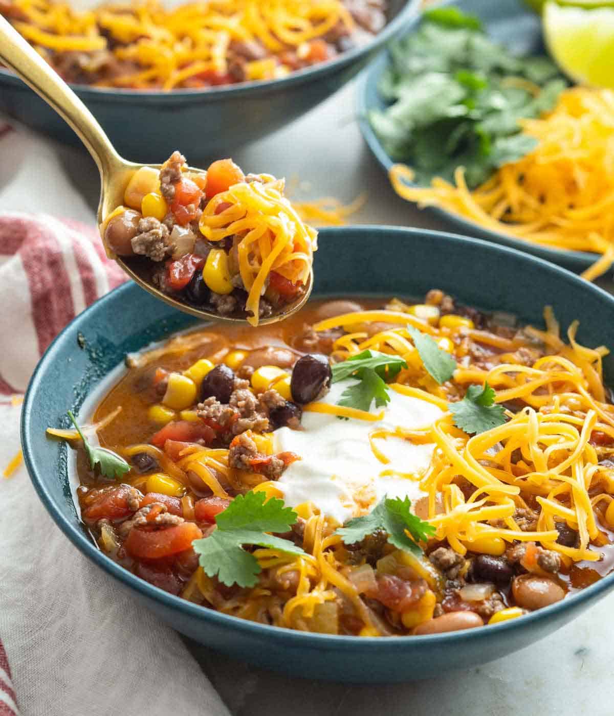 A spoonful of taco soup lifted from the bowl.