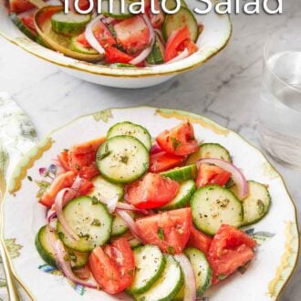 Pinterest graphic of a plate of cucumber tomato salad with a platter in the background.