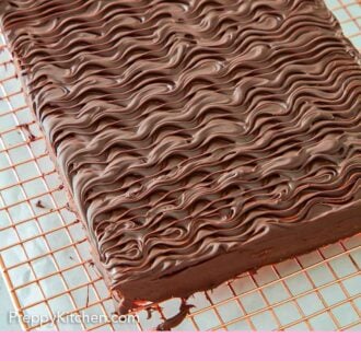 Pinterest graphic of an overhead view of an uncut sheet of rainbow cookies with chocolate on top.