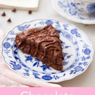 Pinterest graphic of a plate with a chocolate scone with a cup of coffee and a book in the background.