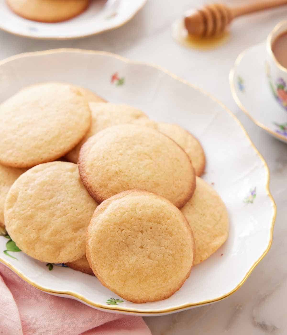 A platter with a bunch of honey cookies.