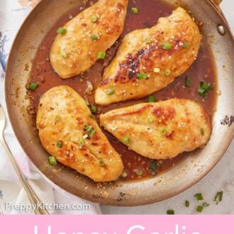 Pinterest graphic of an overhead view of a skillet with four honey garlic chicken breasts with sesame seeds and green onions on top.