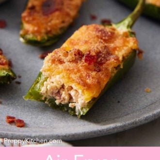 Pinterest graphic of an air fryer jalapeno poppers on a plate with one with a bite taken out of it.
