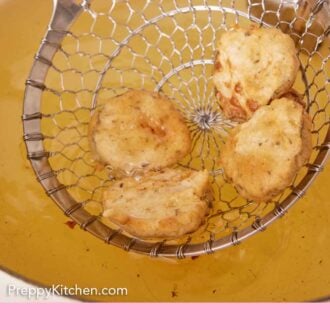 Pinterest graphic of fried pickles strained out of a pot of oil.
