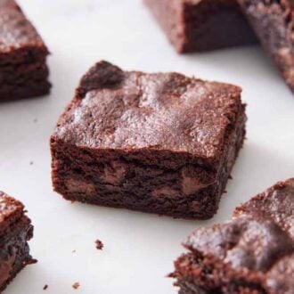 Multiple air fryer brownies on a marble surface.