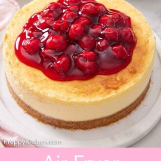 Pinterest graphic of an air fryer cheesecake with cherry sauce on top.