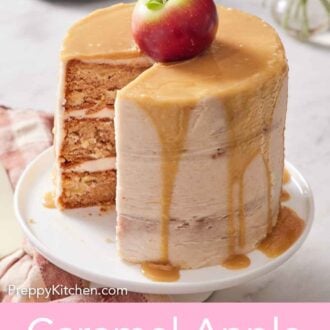 Pinterest graphic of a caramel apple cake with a slice cut out on a white cake stand.