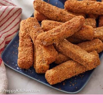 Pinterest graphic of a platter of mozzarella sticks with a bowl of marinara sauce.