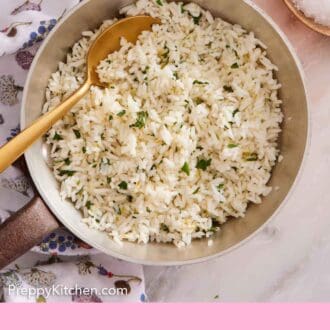 Pinterest graphic of cilantro lime rice in a small pot with a spoon inside.