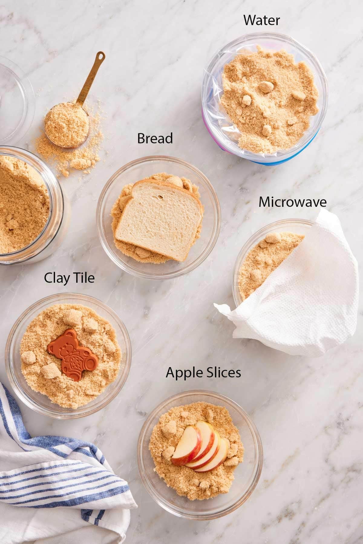 Five bowls of brown sugar showing how to soften brown sugar with five different methods.