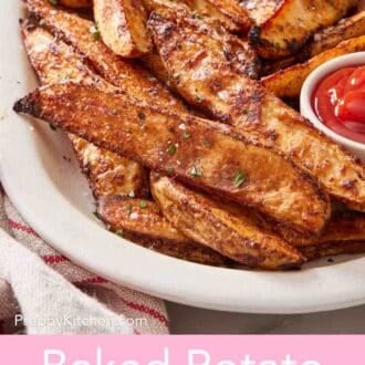 Pinterest graphic of a close-up of easy baked potato wedges on a large white platter.