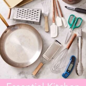 Pinterest graphic showing Overhead shot of various essential kitchen tools & essentials like pots, pans, spatulas, scissors, and more.