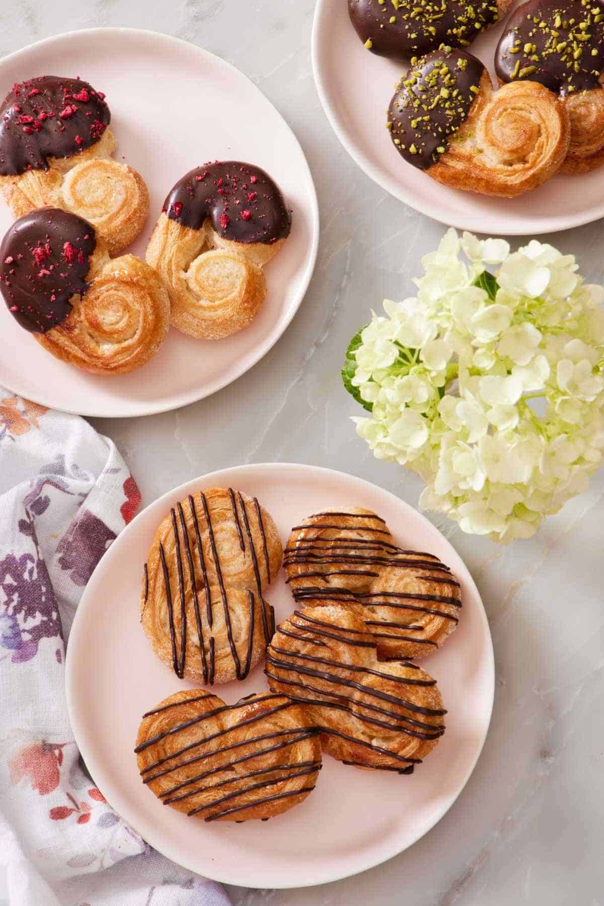 Overhead shot of palmiers dipped in and drizzled with chocolate.